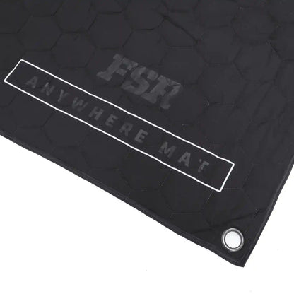 Close up of the FSR Anywhere Camping Mat branding and reinforced corner grommet on a white background