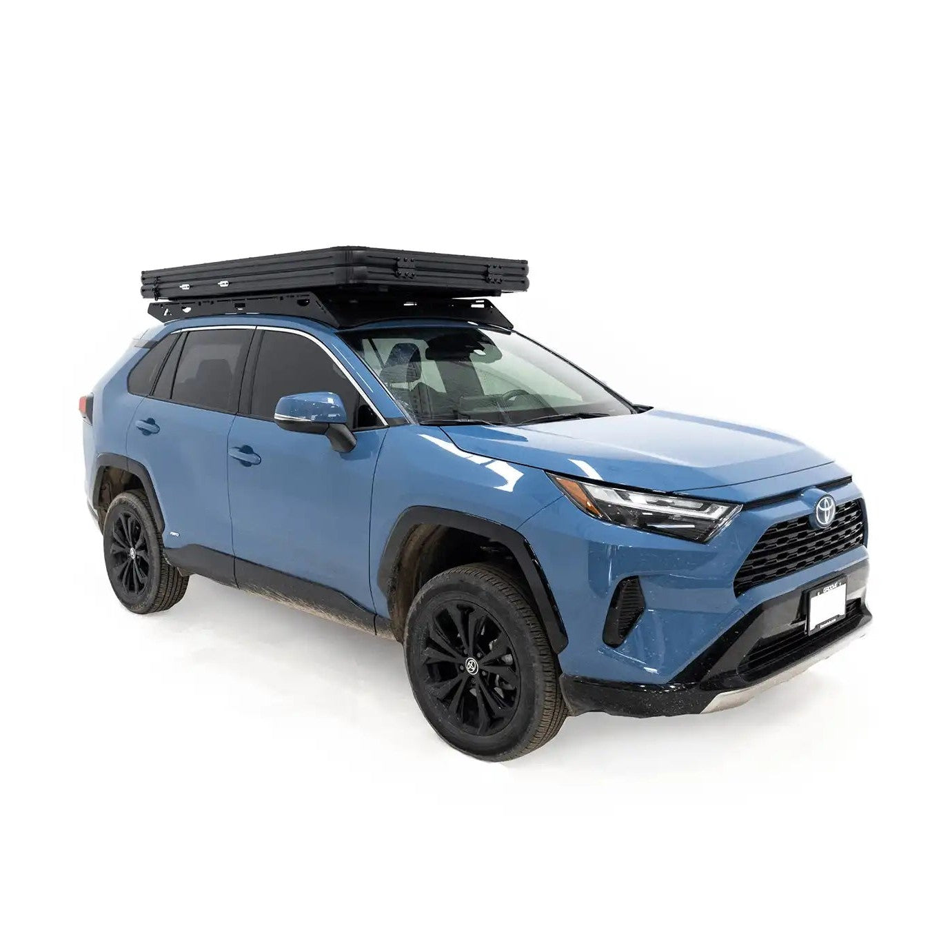 Photo of FSR Aspen Lite Standard Rooftop Tent by Free Spirit Recreation closed and mounted on a blue Toyota Rav4 roof rack