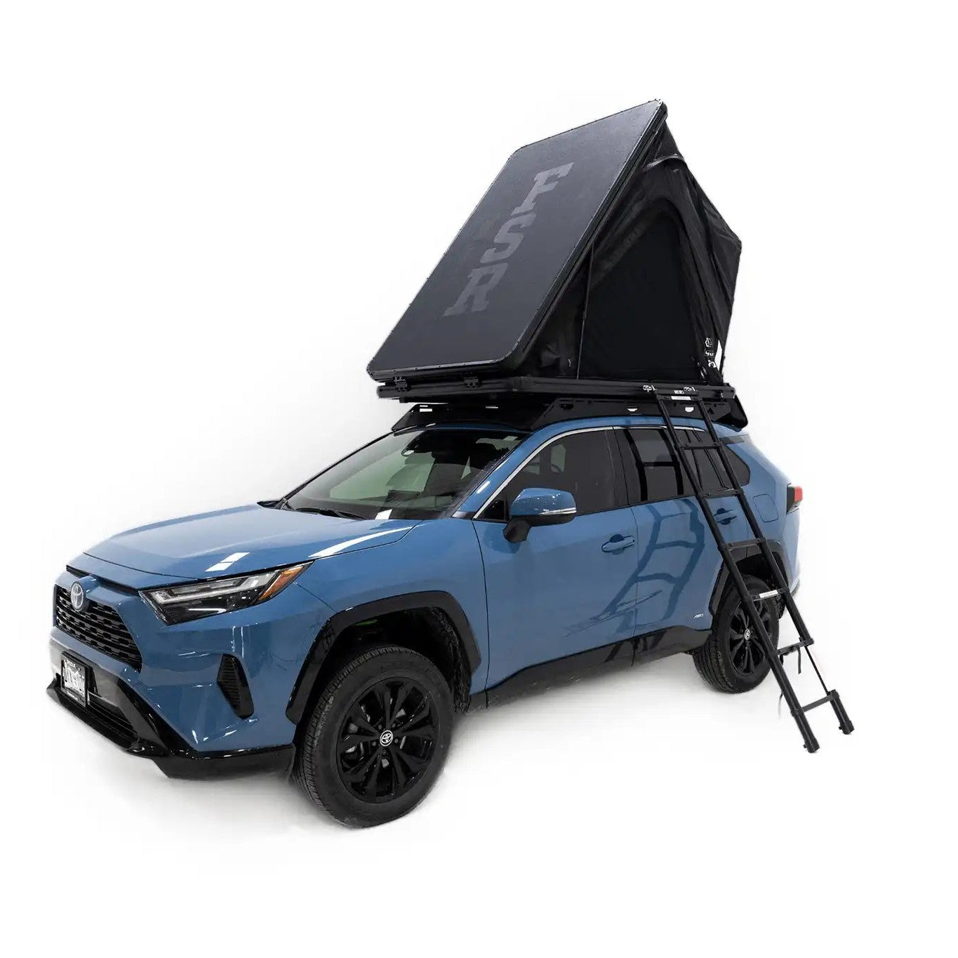 Photo of FSR Aspen Lite Standard Rooftop Tent by Free Spirit Recreation deployed and mounted on a blue Toyota Rav4