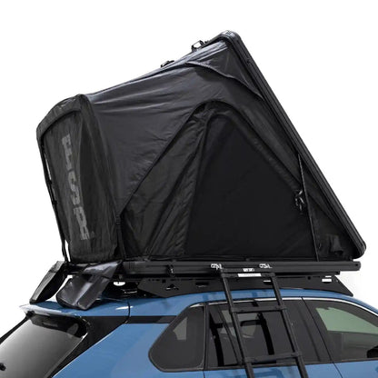 FSR Aspen Lite Standard Roof Top Tent from Free Spirit Recreation installed on a blue car's roof rack