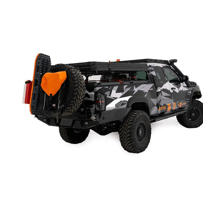 FSR Aspen Lite XL Rooftop Tent by Free Spirit Recreation in its closed position installed on the bed rack of a Toyota Tacoma.