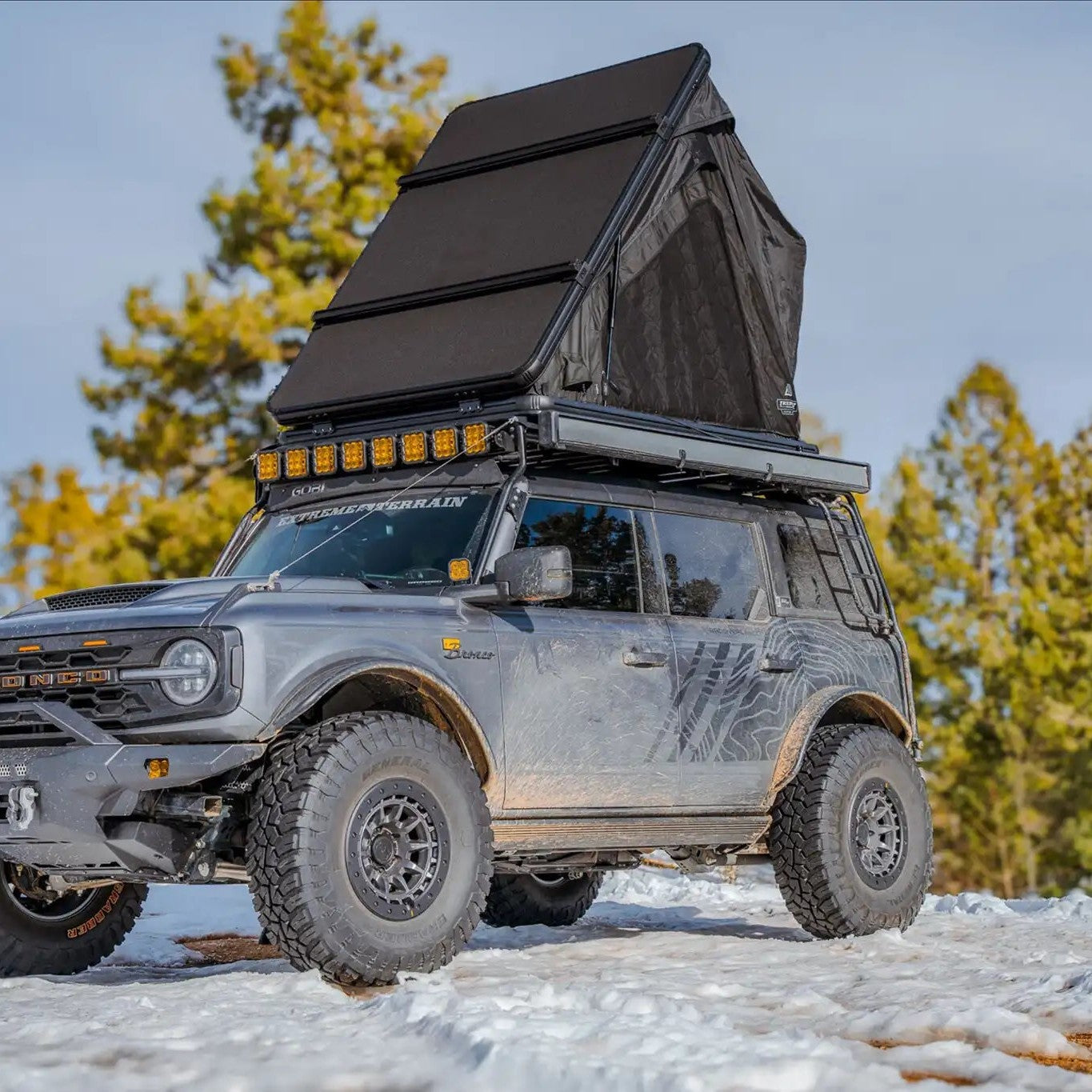 Exterior photo of the FSR Aspen Lite XL Rooftop Tent showing the included crossbars for cargo storage and mounting.