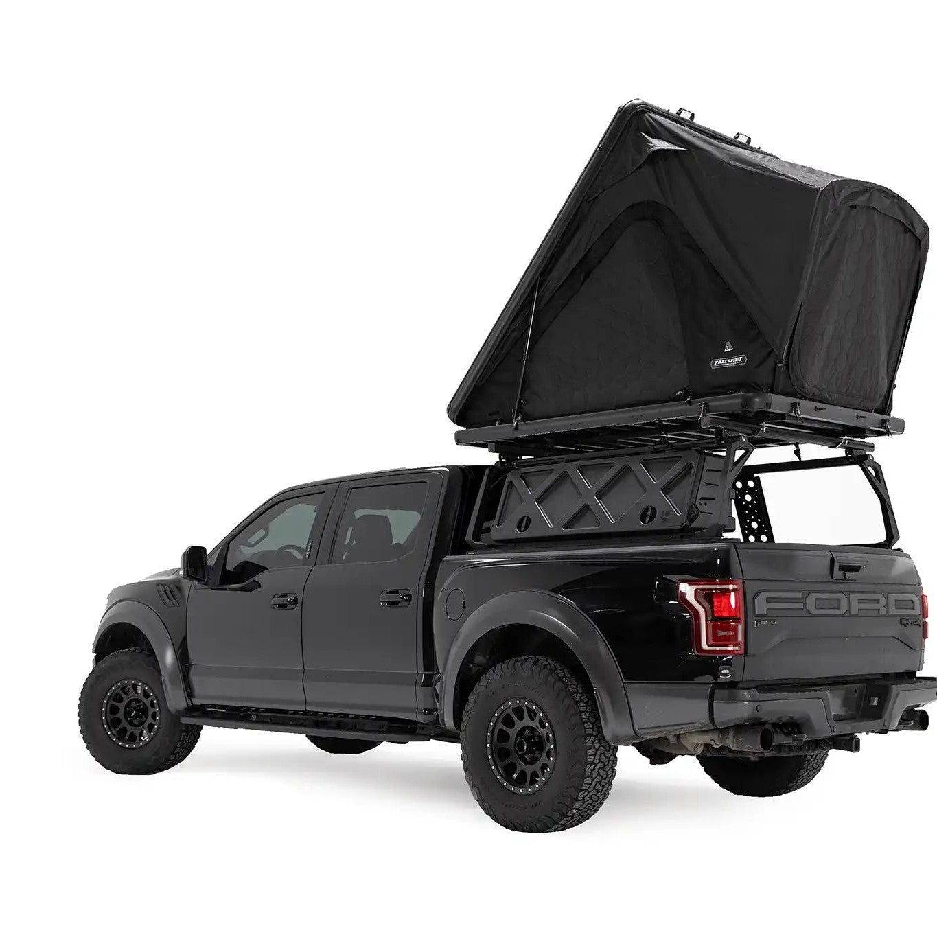 FSR Aspen Lite XL Rooftop Tent by Free Spirit Recreation deployed on a black Ford Raptor bed rack.