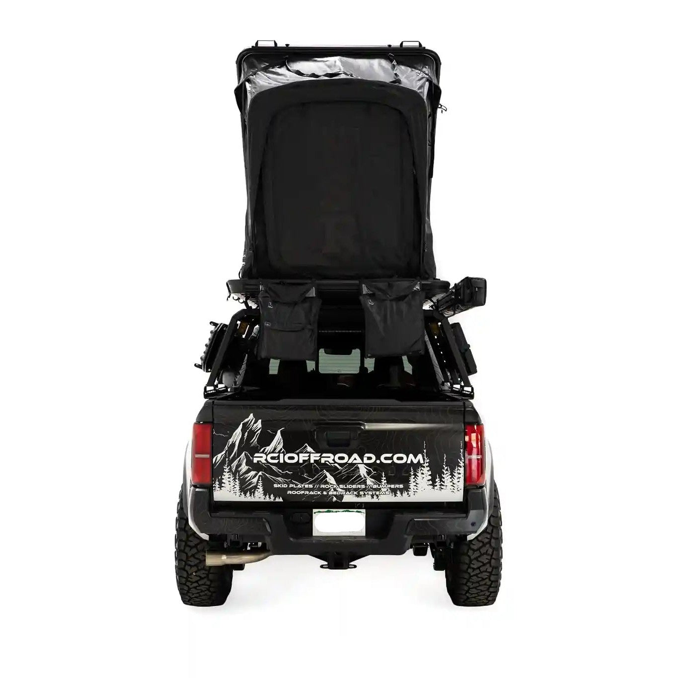 Rear-facing image of the FSR Aspen Pro rooftop tent from Free Spirit Recreation mounted on a Toyota Tacoma short bed pickup.