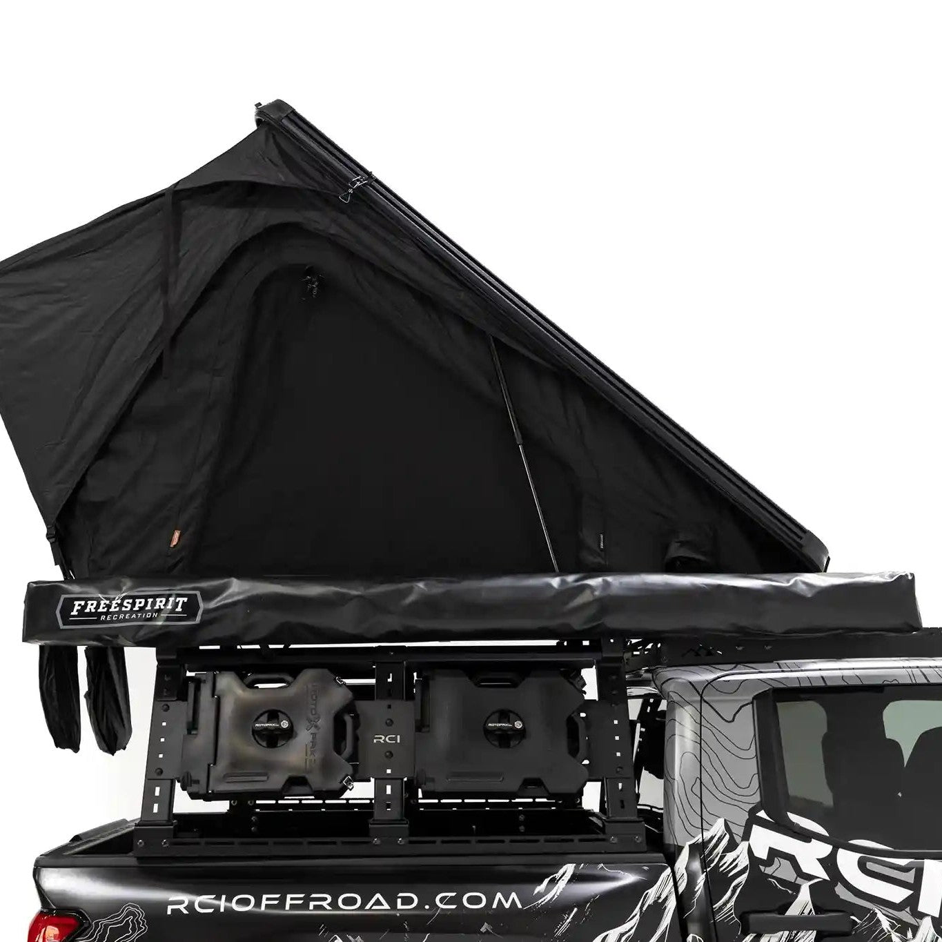 Side profile image of the FSR Aspen Pro rooftop tent from Free Spirit Recreation mounted on the bed a short bed Toyota Tacoma with roof rack