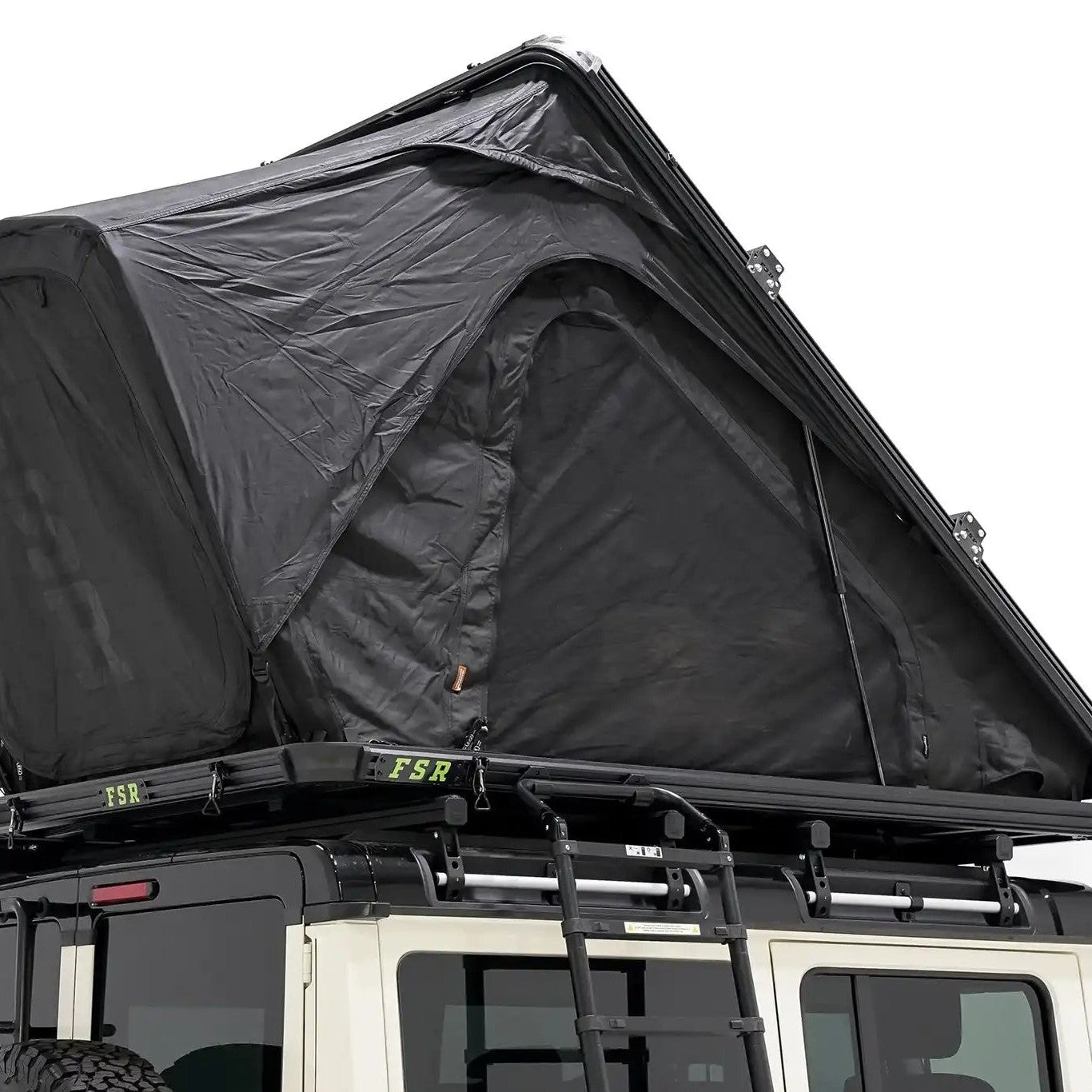 Image of the exterior of the FSR Aspen Pro XL roof top tent from Freespirit Recreation installed and deployed on the roof rack of an Ineos Grenadier