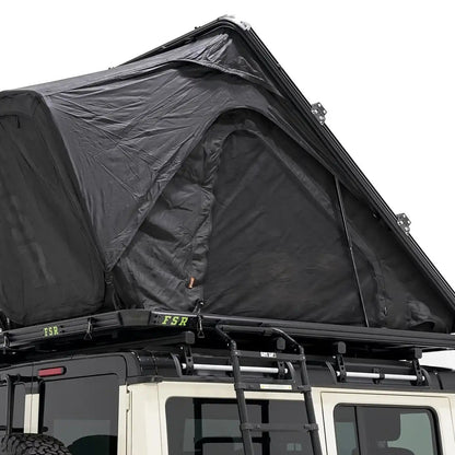 Image of the exterior of the FSR Aspen Pro XL roof top tent from Freespirit Recreation installed and deployed on the roof rack of an Ineos Grenadier