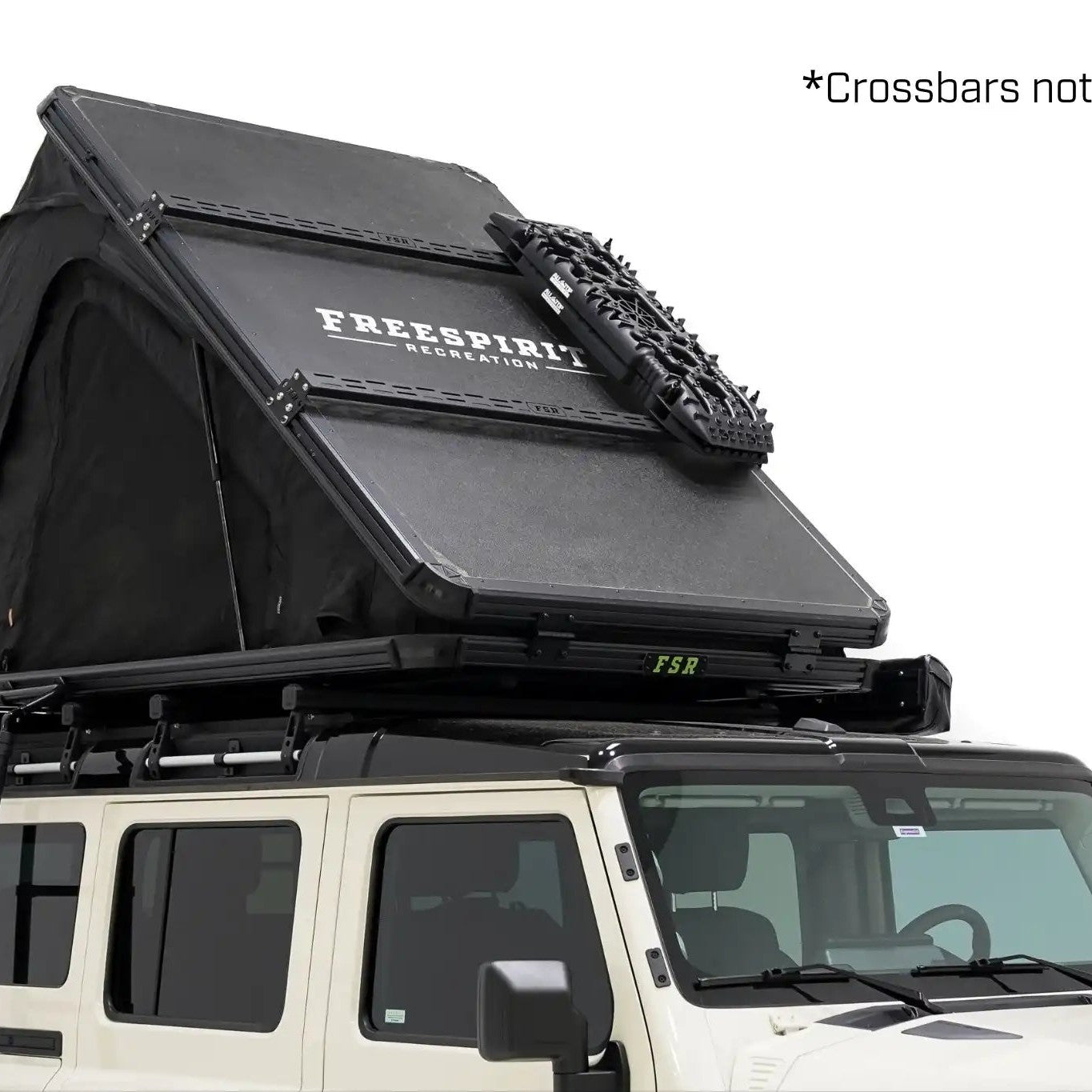 Freespirit Recreation Aspen Pro XL roof top tent installed on a Ineos Grenadier with  'crossbars not included' text in the upper right-hand corner.