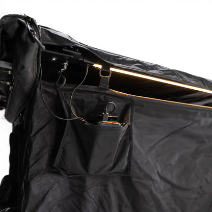 Close up image of the built-in dimmable LED light and exterior storage pocket on the FSR Shower Awning for camping and overlanding