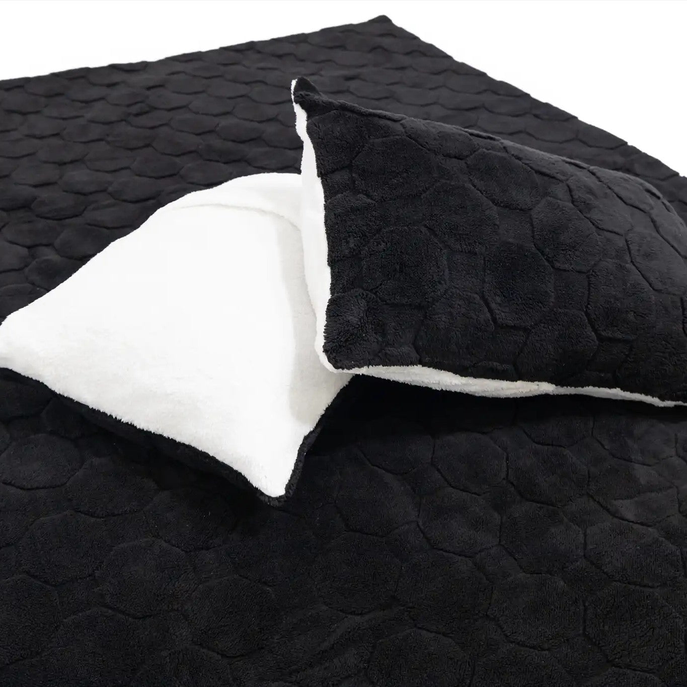 Close up of the front and back of the quilted pillow cases included in the FSR Cloud Comforter Rooftop Tent Bedding Set