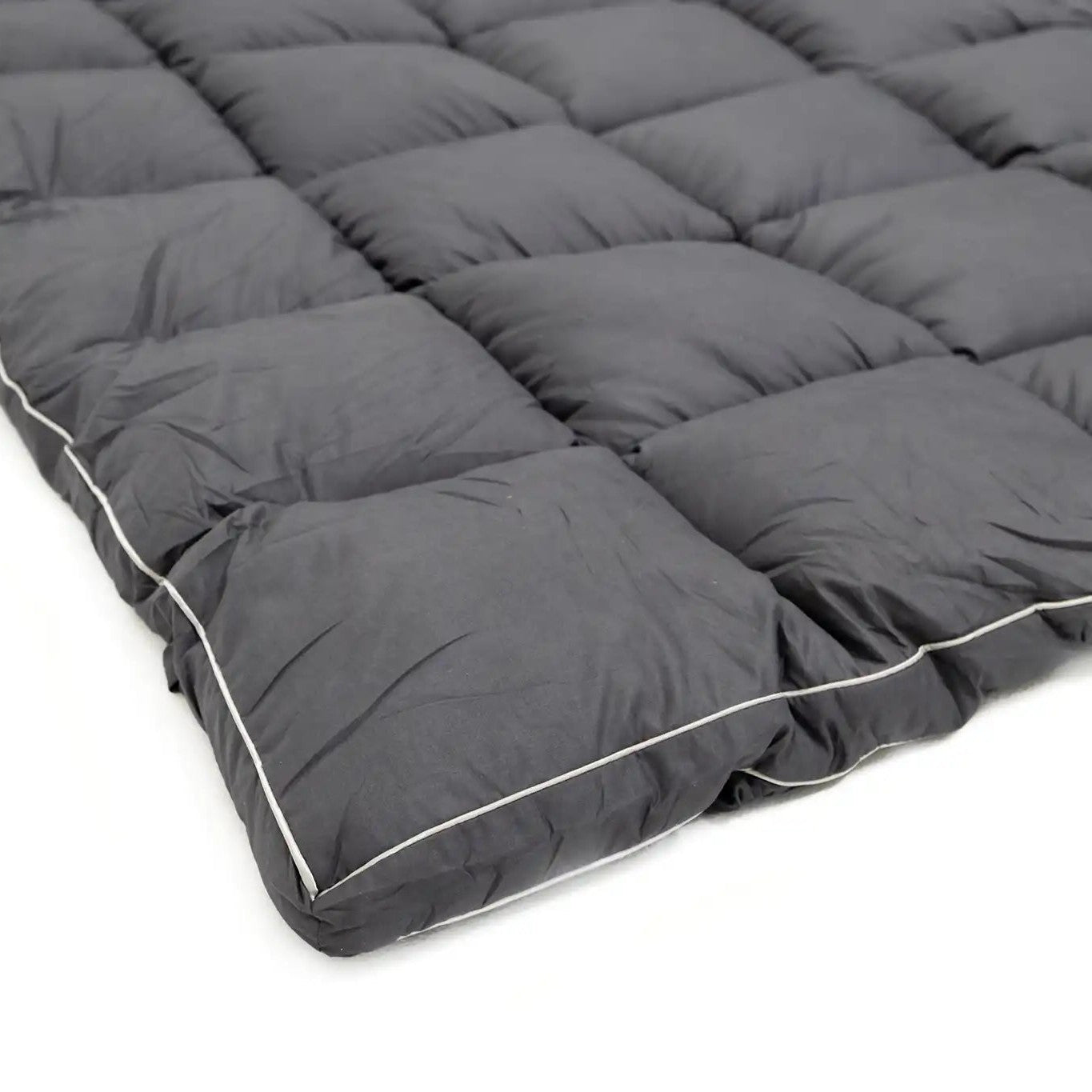 Close up of the premium gray fabric used on the FSR quilted mattress topper for rooftop tents from Free Spirit Recreation