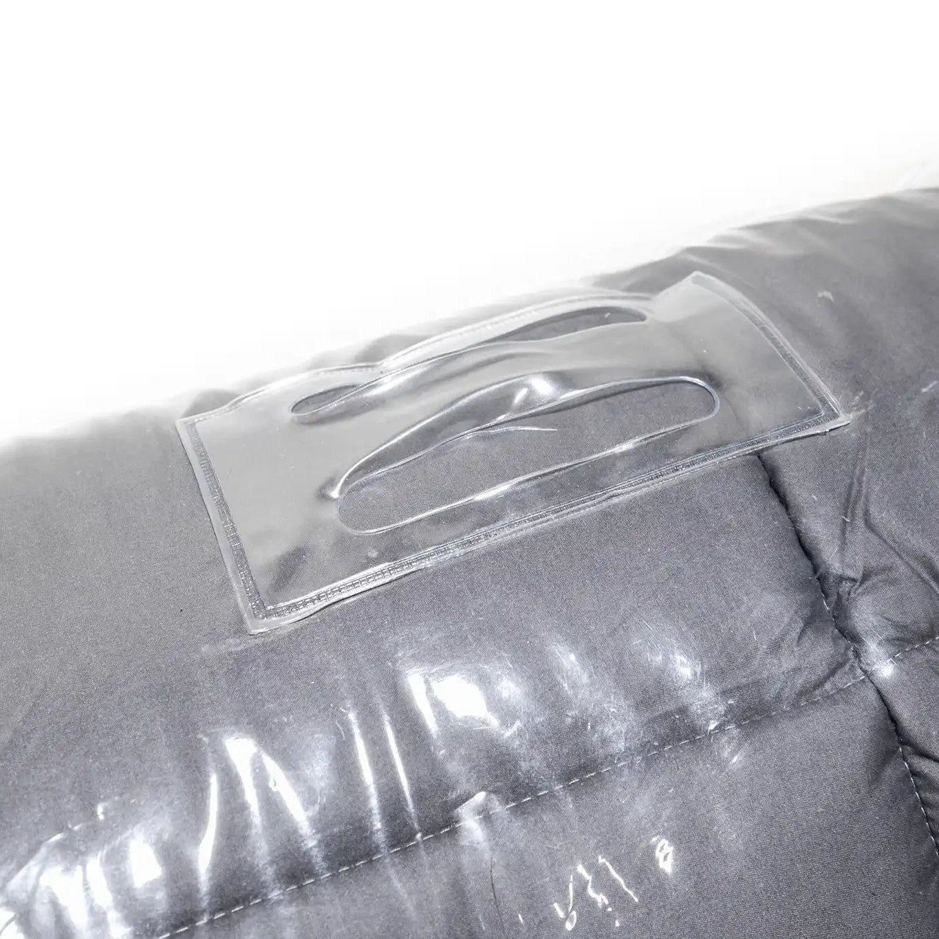 Close up image of the storage bag loop on the FSR Cloud Topper rooftop tent mattress topper's clear plastic zippered storage bag