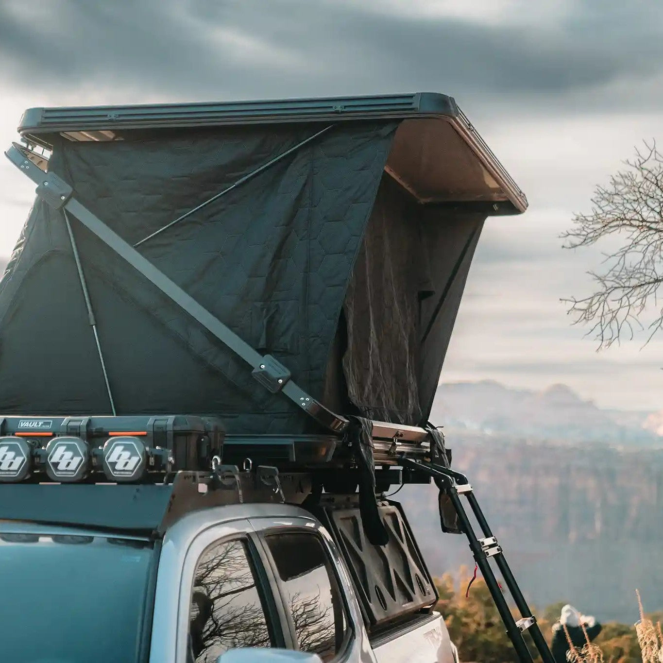 FSR Evo V3 XL rooftop tent on an overland vehicle setup for camping with a scenic canyon view in the background