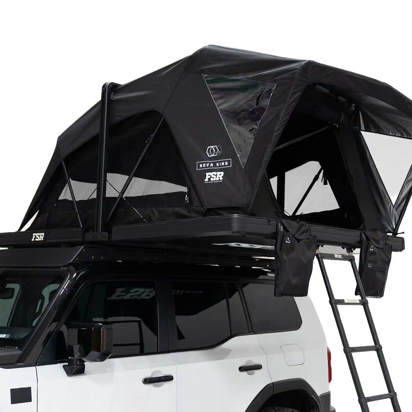 Close-up exterior photo of the Nova King rooftop tent mounted on a white Toyota Land Cruiser with the tent windows and door open.