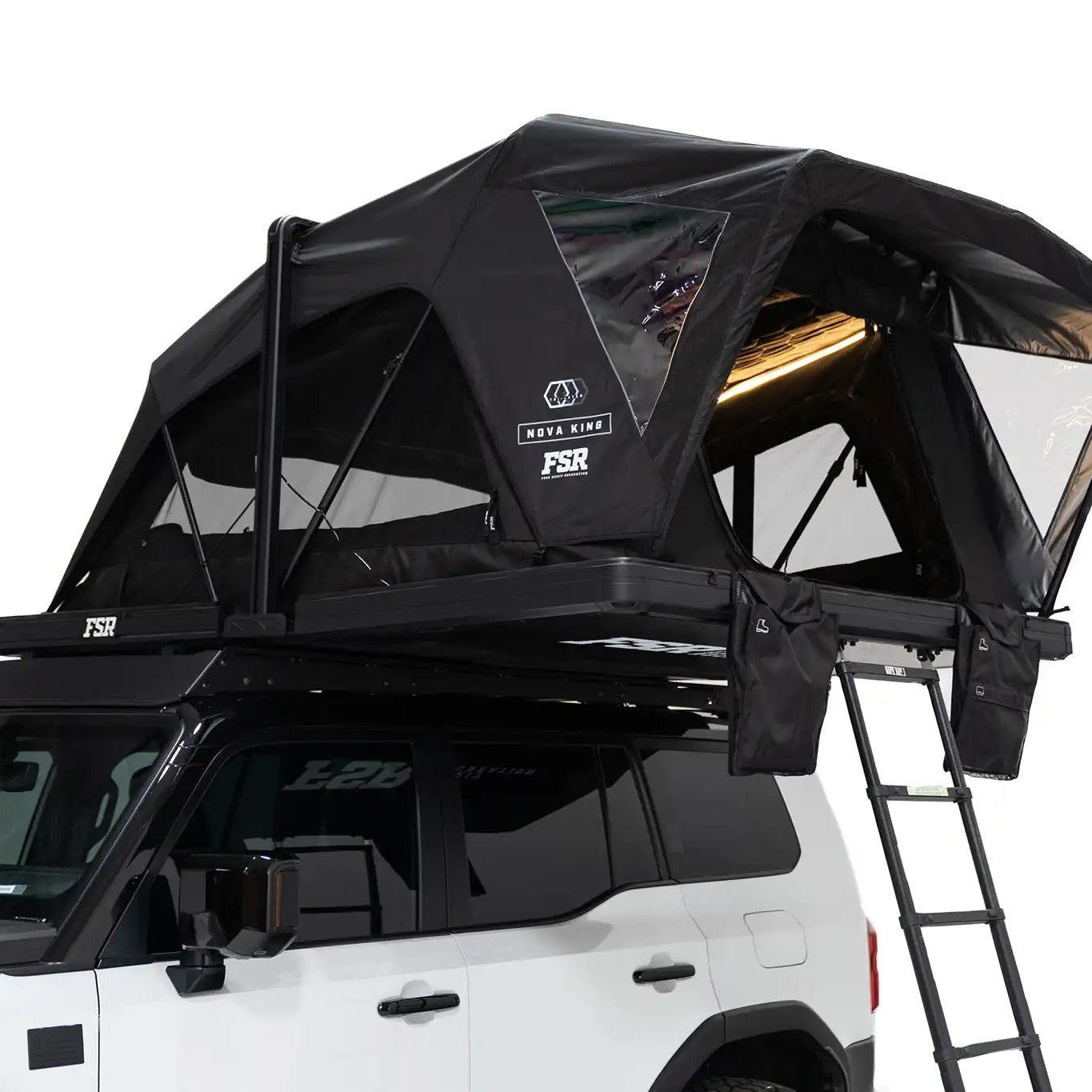 Close-up exterior photo of the Nova King rooftop tent mounted with the interior LED tent lights on.