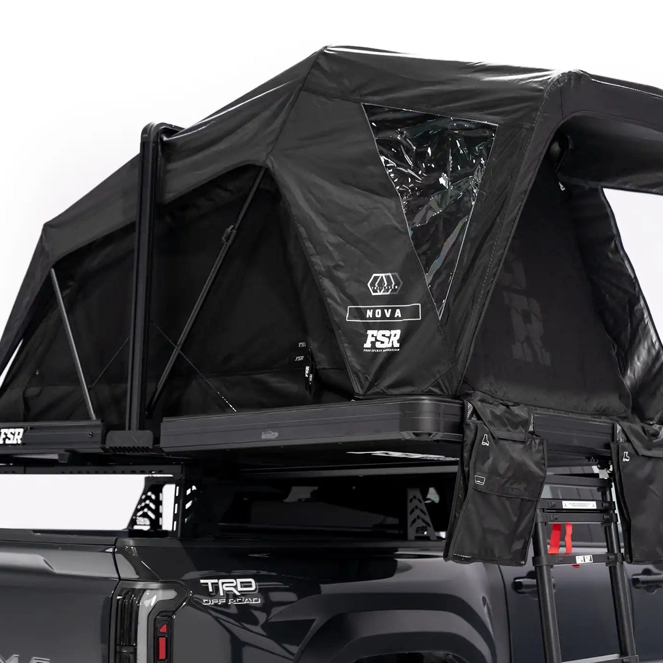 Photo of FSR Nova rooftop tent deployed on the rear of a 2025 Toyota Tacoma with all the doors and windows closed.