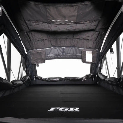 Interior photo of FSR Nova rooftop tent deployed with the interior lights off.