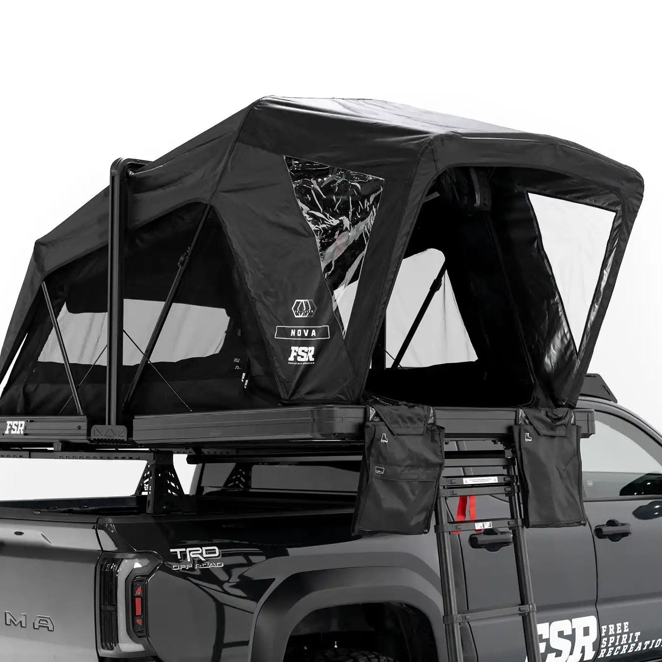 Photo of FSR Nova Standard Tri-Layer rooftop tent deployed on the rear of a black 2025 Toyota Tacoma.