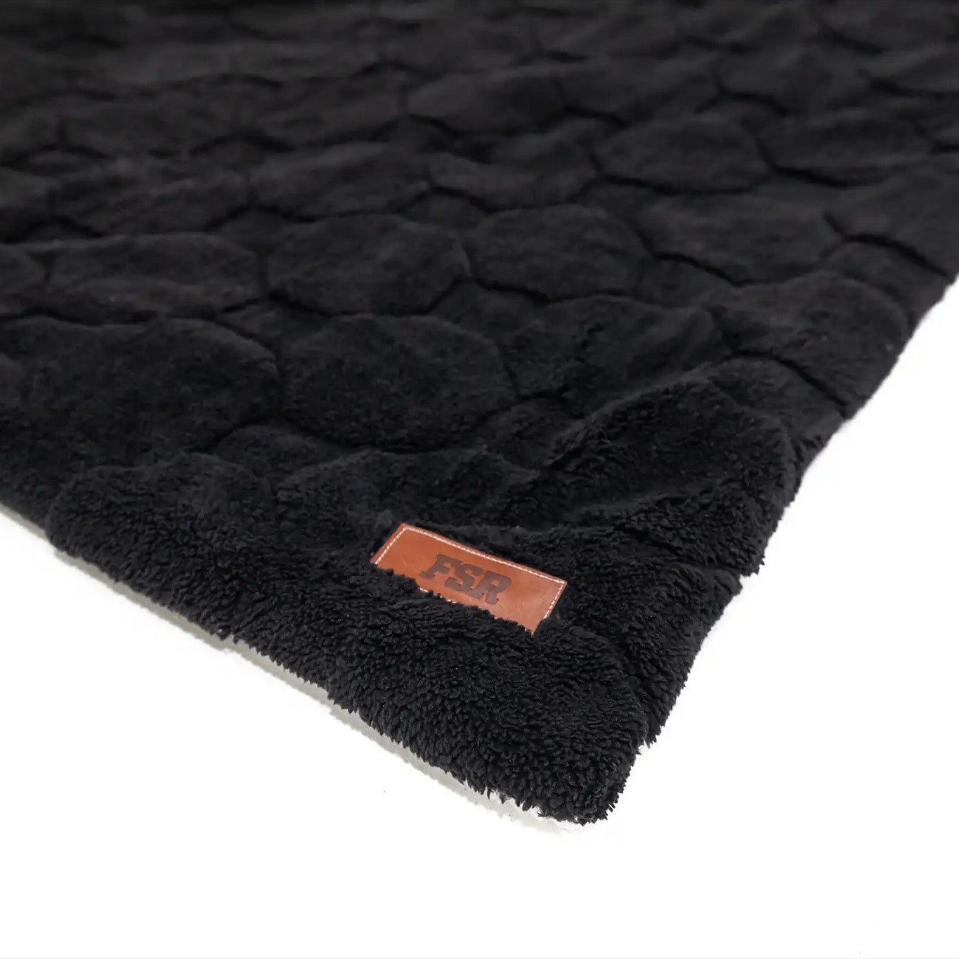 Close-up of the FSR Branding on the FSR Cloud Comforter in the Rooftop Tent Bedding Set from Freespirit Recreation