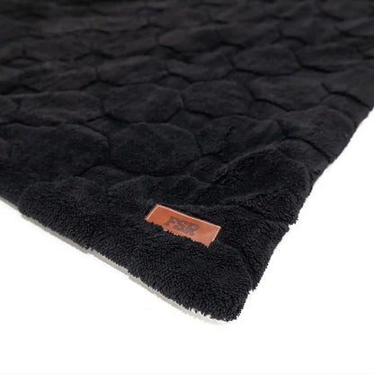 Close-up of the FSR Branding on the FSR Cloud Comforter in the Rooftop Tent Bedding Set from Freespirit Recreation