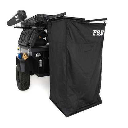 Image of the open FSR Shower Awning from Freespirit Recreation mounted to the back of an overland trailer to use as a camping shower and bathroom tent