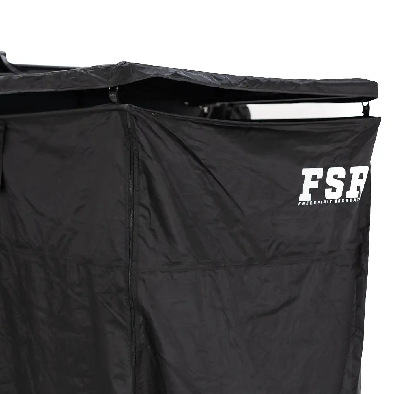 Close up image of the Shower Awning with curtain and roof installed with FSR branding visible mounted to a Freespirit Recreation roof top tent for use as a camping shower and bathroom tent