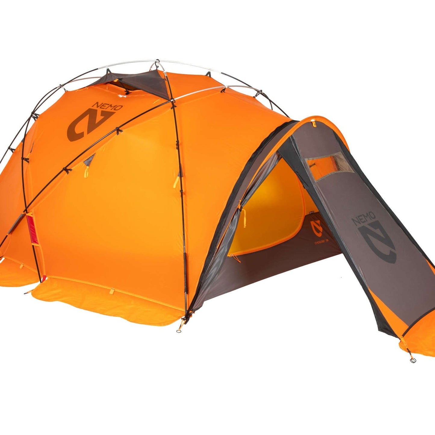 The NEMO Equipment Chogori™ Mountaineering Tent is a bright orange and gray, dome-shaped four-season tent with multiple support poles, an extended vestibule, and a visible NEMO logo. One of its flaps is partially open.