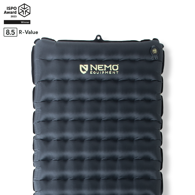 A black NEMO Equipment Tensor™ Extreme Conditions Ultralight Insulated Sleeping Pad with horizontal baffles, Thermal Mirror film for warmth, ISPO Award 2023 Winner badge, and an 8.5 high R-value label in the top left corner.