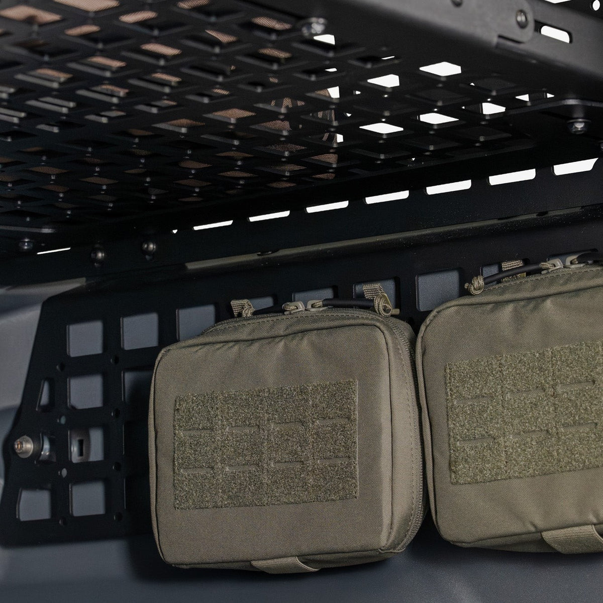 Pouches mounted to the Rear Window Molle Storage Panels for the 2023-2026 INEOS Grenadier