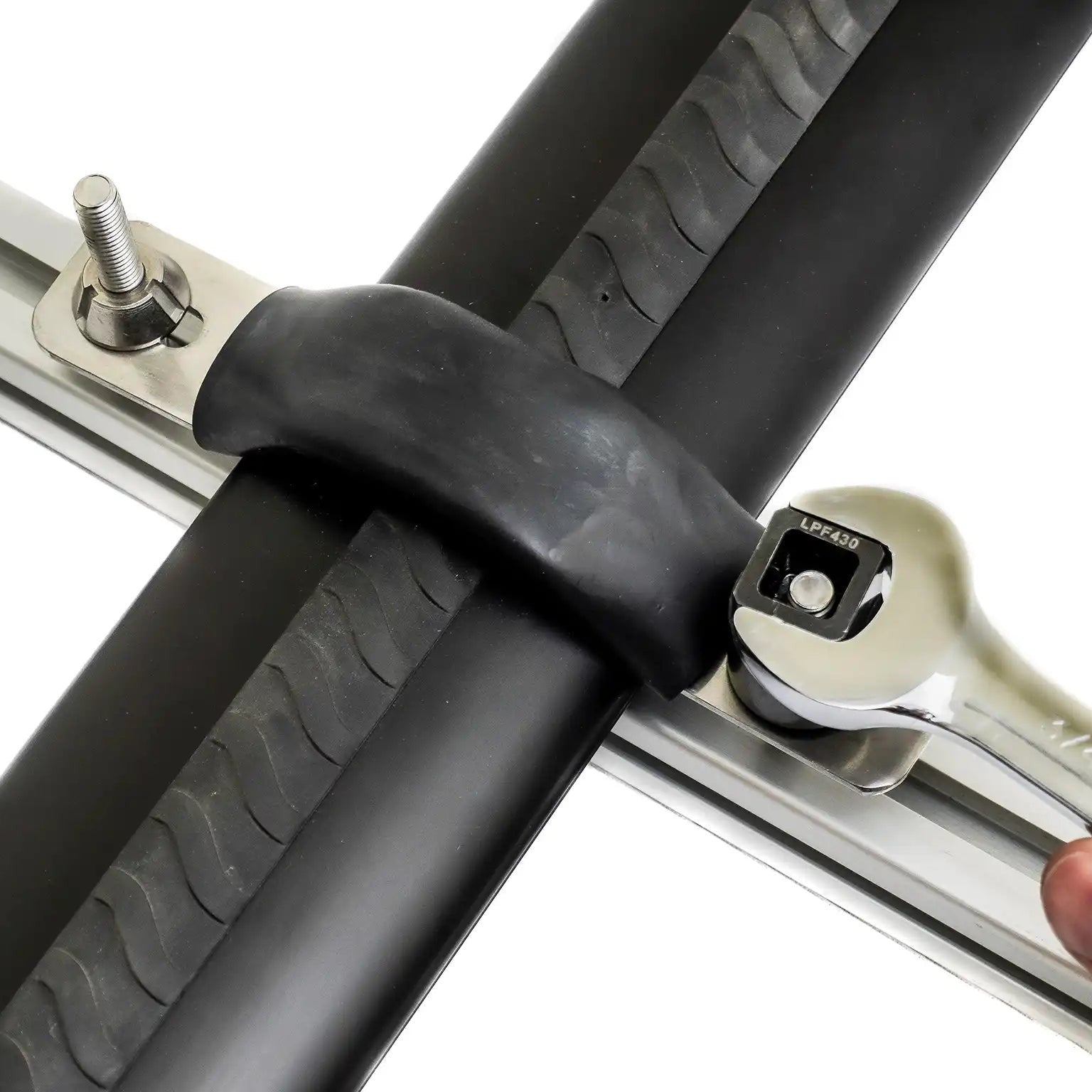 Close-up of a person using a wrench and the specialty security nut tool to install the FSR M8 Security Nuts