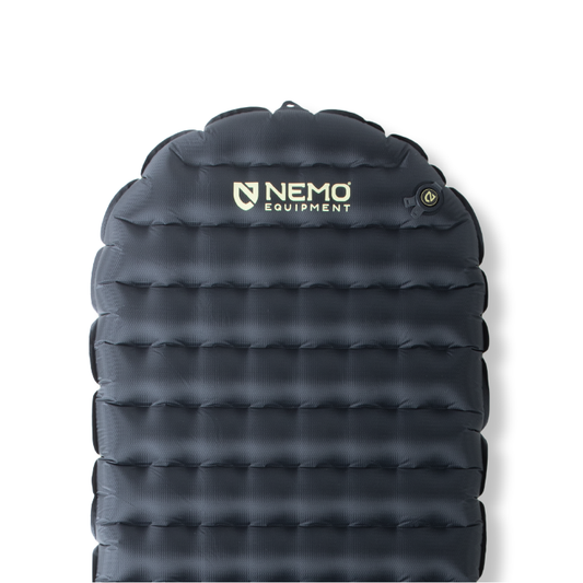 A close-up of the dark grey NEMO Equipment Tensor™ Extreme Conditions Ultralight Insulated Sleeping Pad highlights the logo and upper right valve, featuring Thermal Mirror film for enhanced warmth.