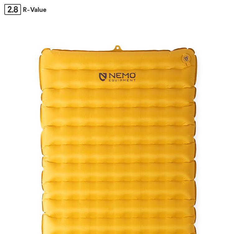 The NEMO Equipment Tensor™ Trail Ultralight Insulated Sleeping Pad is a rectangular yellow inflatable pad with horizontal baffles, top-corner valve, and centered logo. R-value 2.8 shown in the corner; part of the Tensor Trail series.