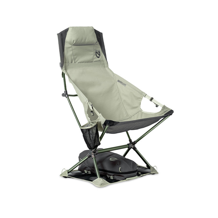 The NEMO Equipment Satellite™ Reclining Anywhere Chair is a lightweight, portable outdoor chair featuring a high backrest, armrests, mesh pockets, and a folding metal frame with an integrated carrying case for full-body support.
