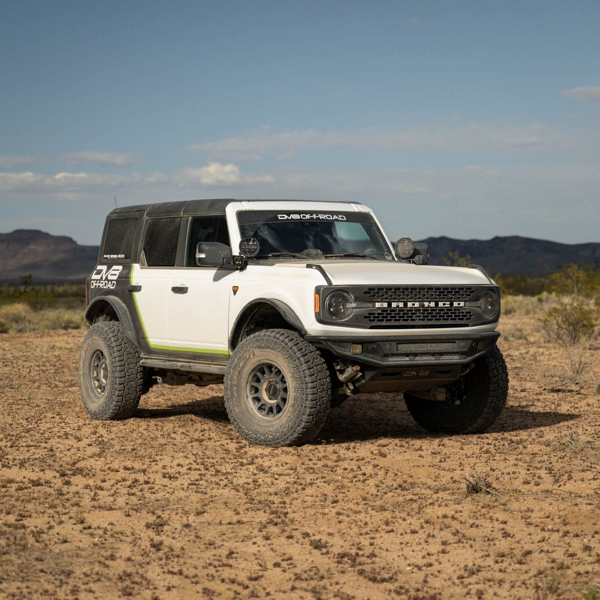 White Bronco with off road parts in a desert landscape