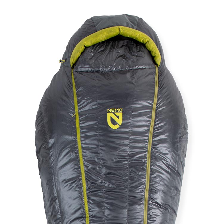 A gray and green Coda™ Endless Promise® Down Mummy Sleeping Bag from NEMO Equipment, featuring a hood and the NEMO logo on the front, is laid flat on a white background.