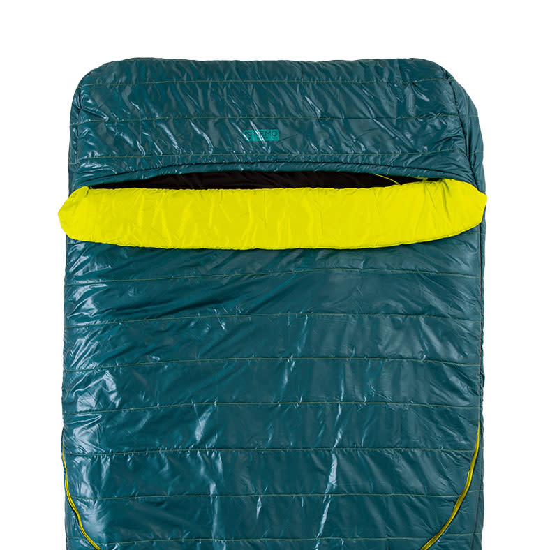 The NEMO Equipment Jazz™ Double Synthetic Sleeping Bag is displayed in teal and yellow, laid flat with its top portion open to reveal the spacious interior.